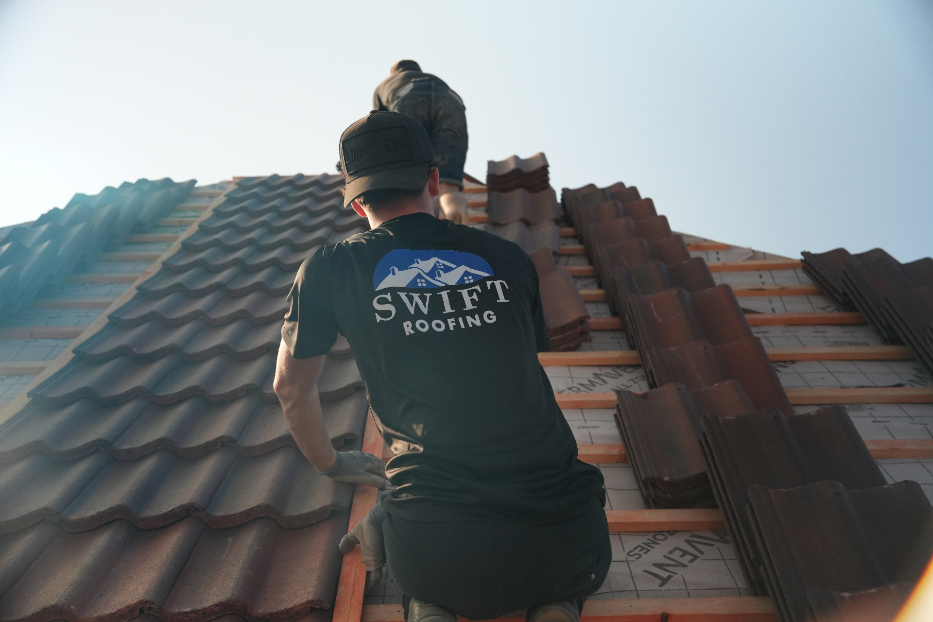 Swift Roofing team working on a roof in Cambridge, Cambridgeshire